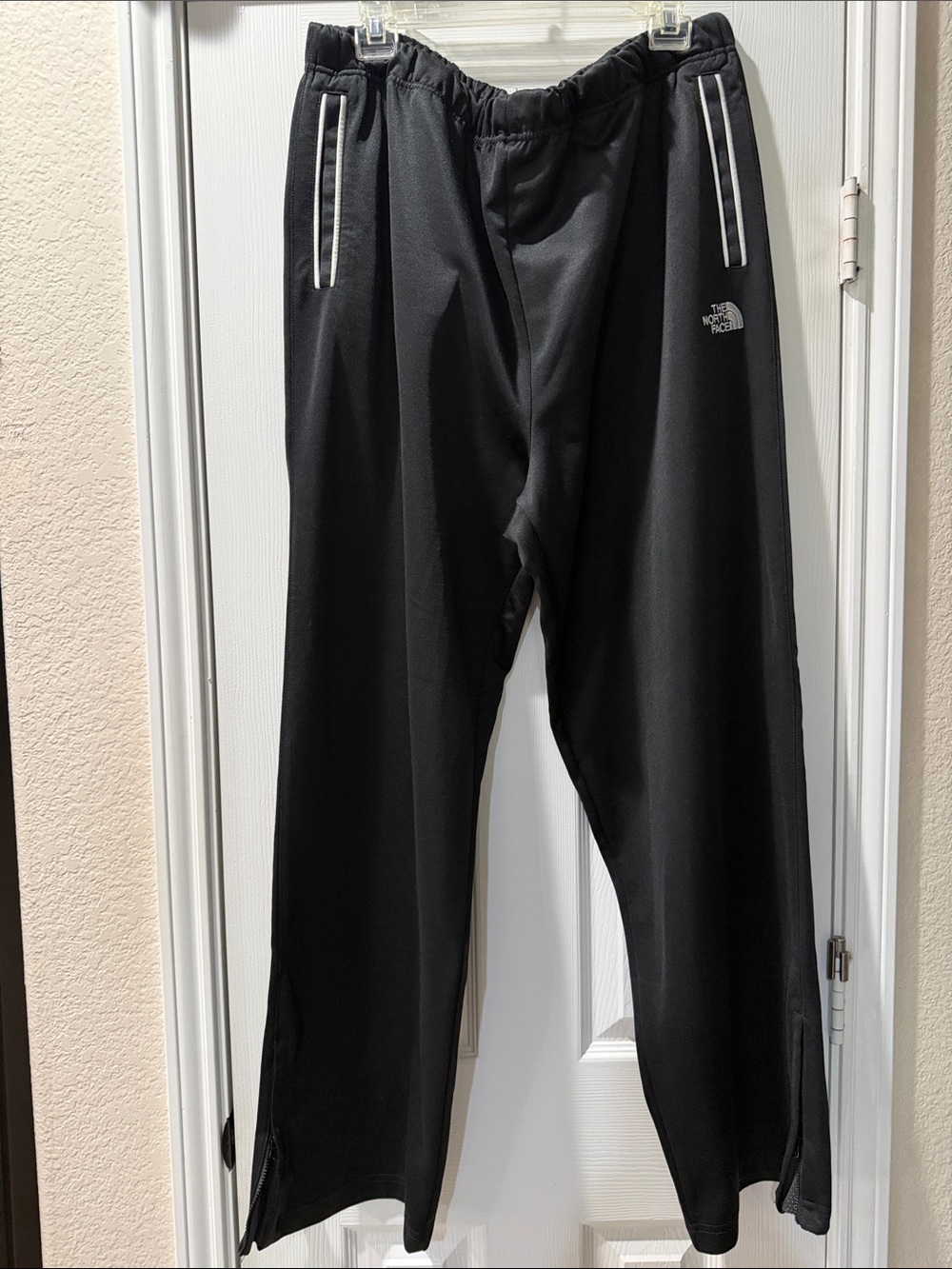 The North Face Black Men’s Zip-Hem track Joggers with White Trim